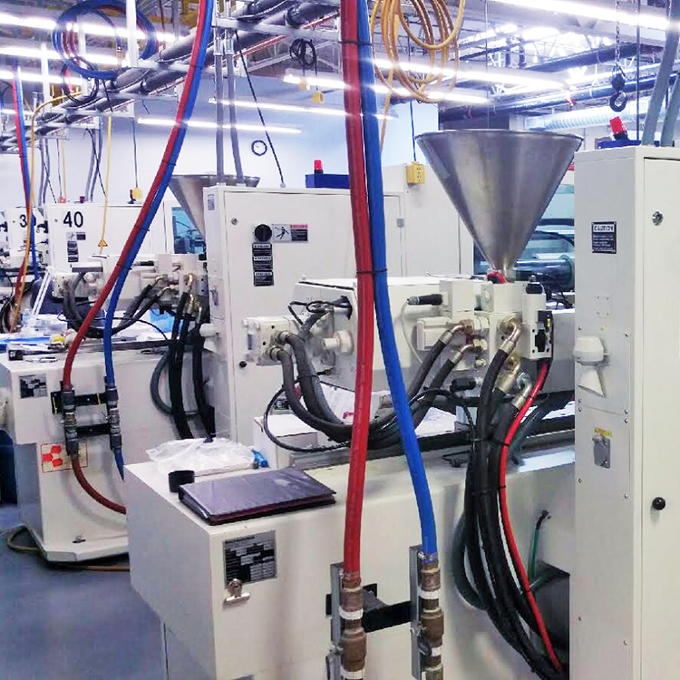 Injection molding machine in operation